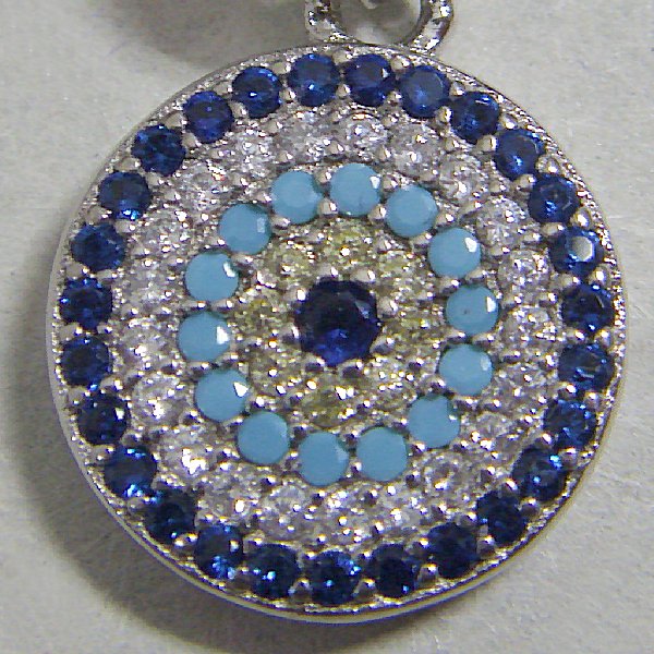 (p1384)Silver circular pendant with multi-colored stones.